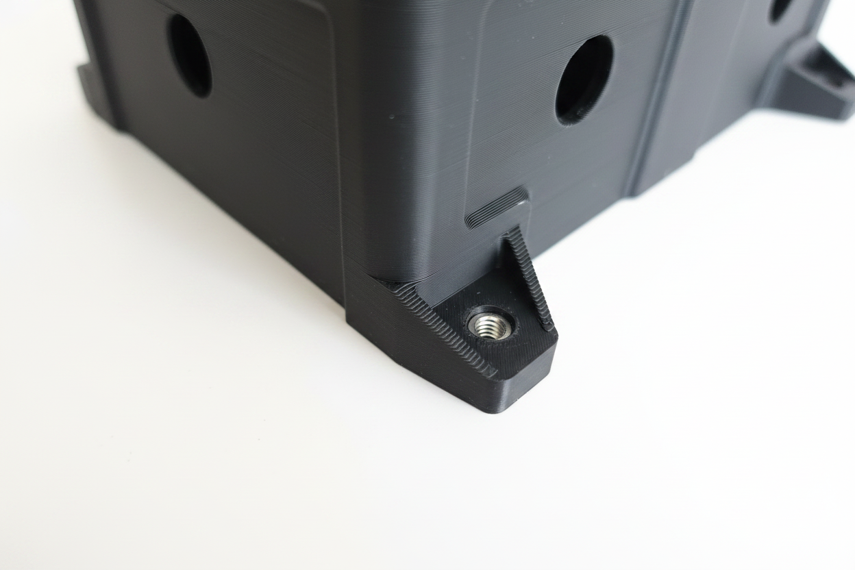 Close-up corner detail showing layer quality and threaded insert